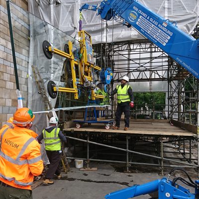 Aquarium glass panel being craned into the natural history museum for their custom aquarium in London.